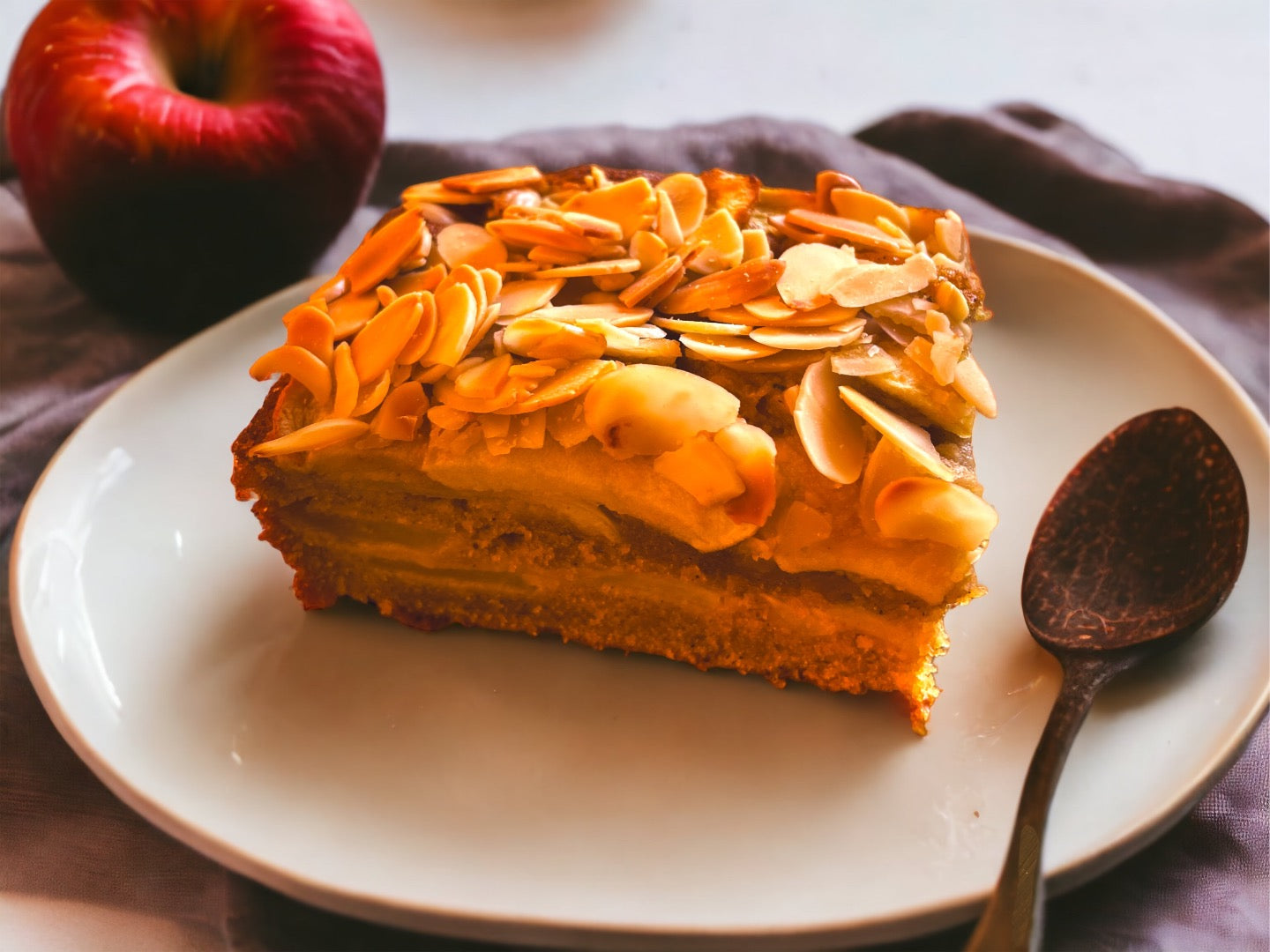 Fresh, hand-picked apples are sliced to perfection and generously layered throughout our Apple Almond Cake.